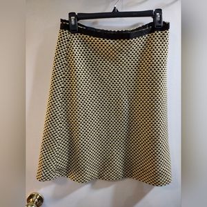 INC size 6 skirt in a yellow black and cream check design. Side zipper.